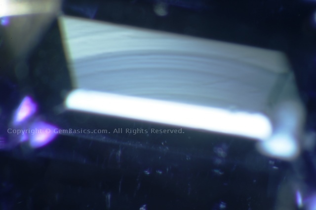 Curved striae in Verneuil synthetic sapphire